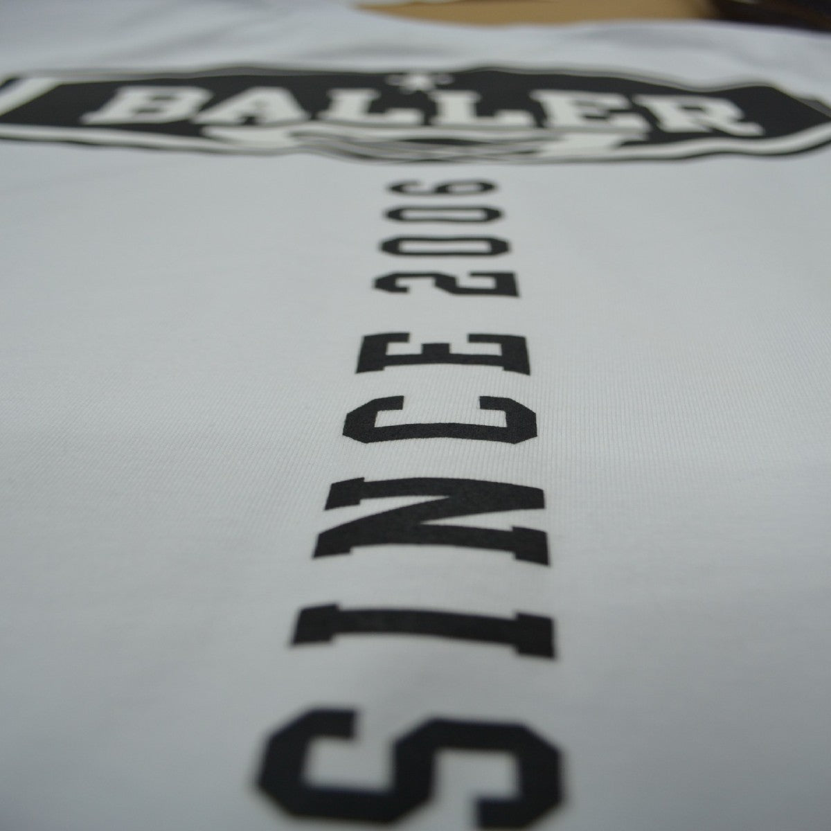 REMERA OVERSIZE BALLER BRAND TRICK